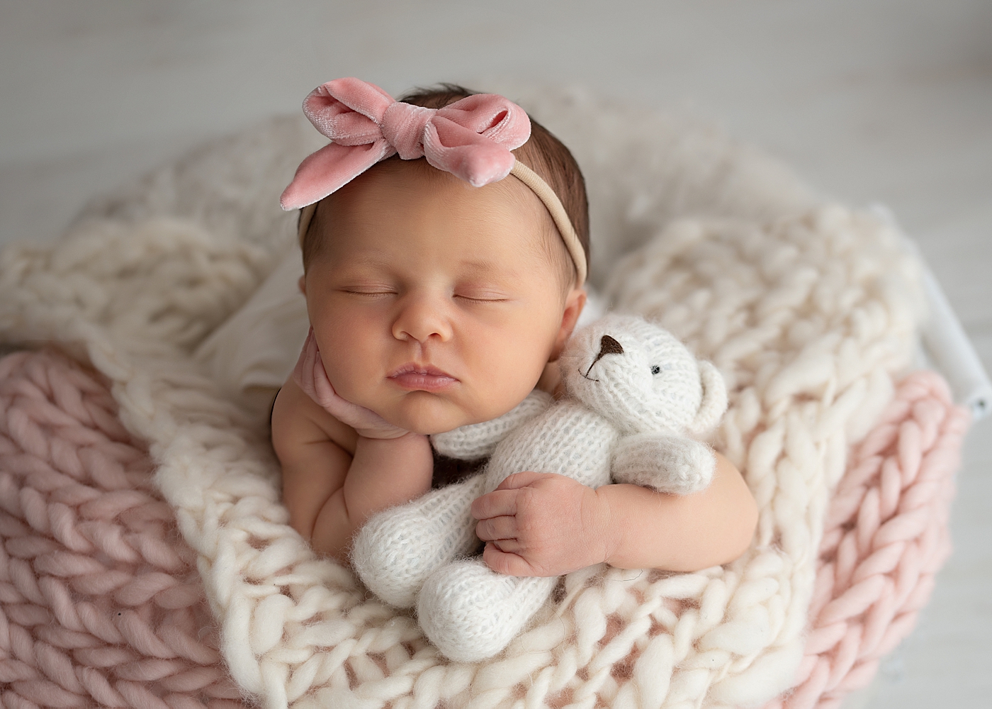 Posed newborn photo in studio with Rachel Brookes Photography.