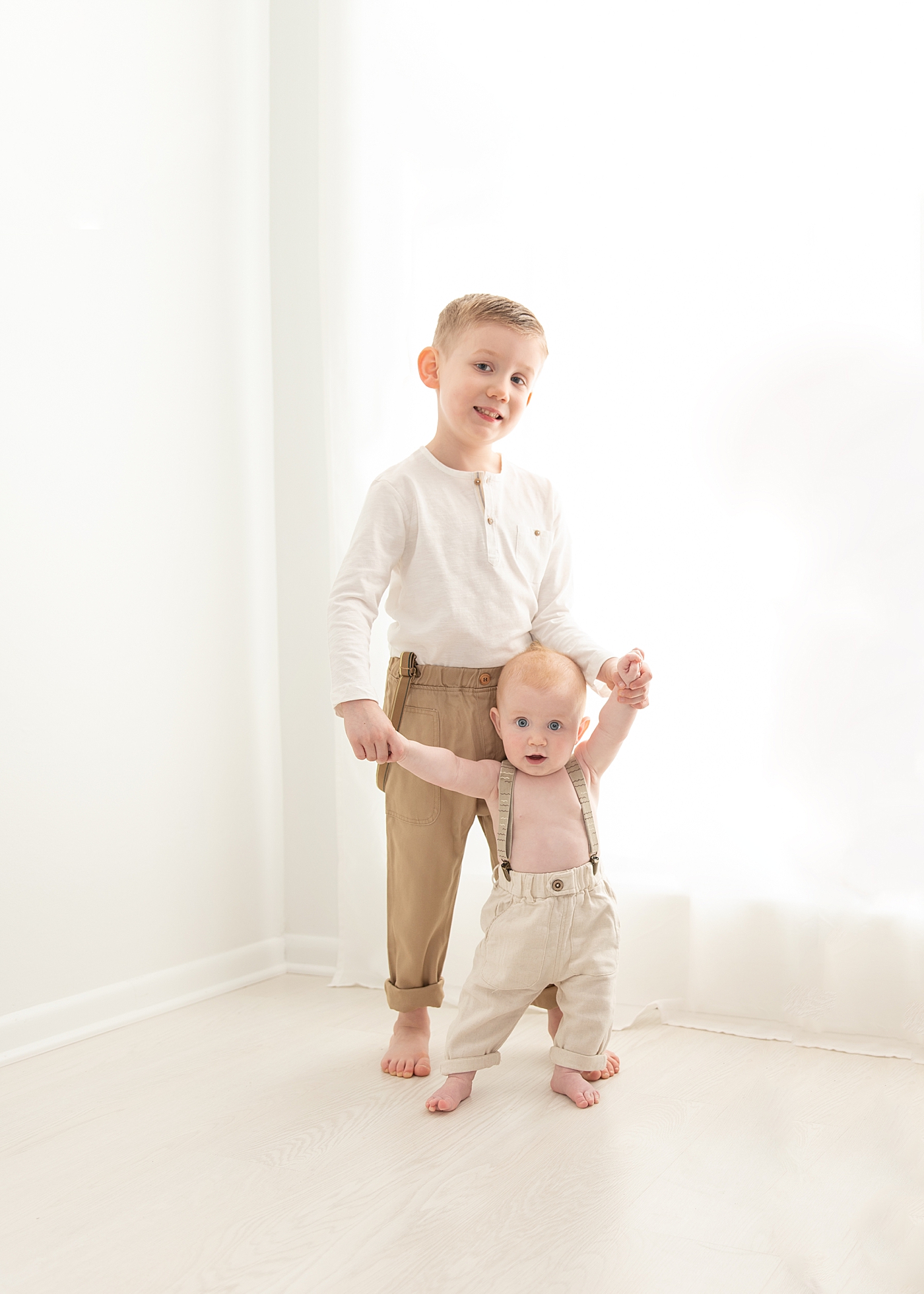 Photos of two brothers in Chagrin Falls studio. Photo by Rachel Brookes Photography.