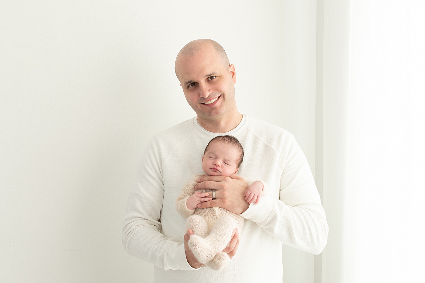 Father and son photo in Chagrin Falls newborn studio. Photo by Rachel Brookes Photography.