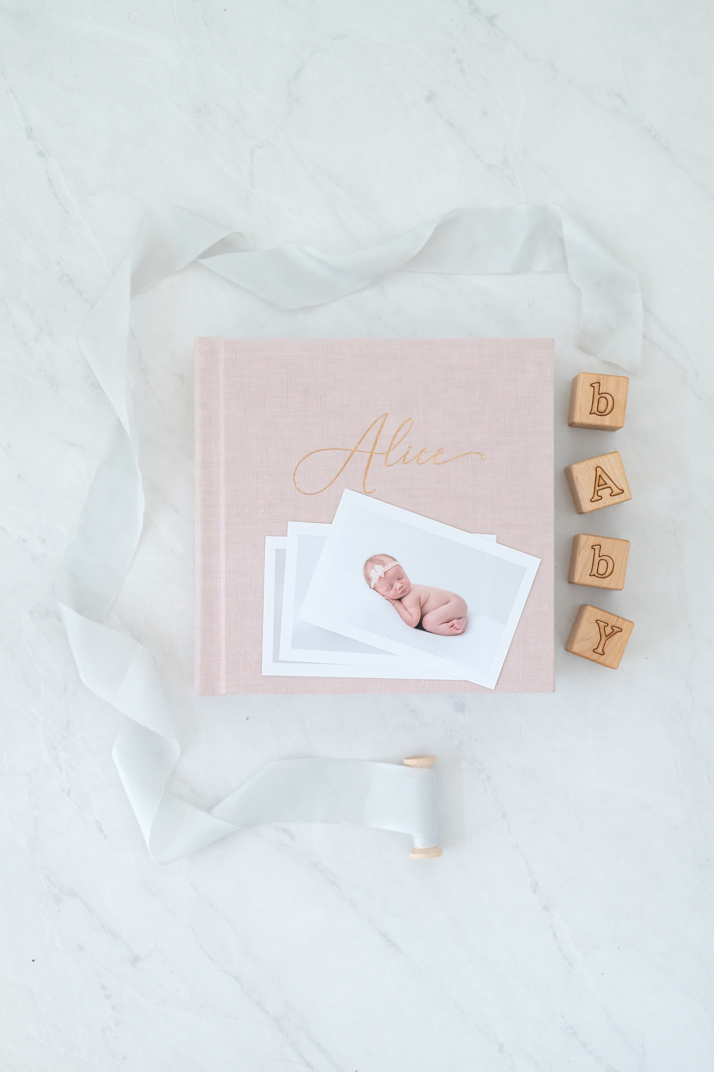 Newborn baby girl linen album | Rachel Brookes Photography